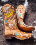 The Sandstone Stallion Corral Boots displayed on cowhide.