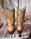 Back view of the Sandstone Stallion Corral Boots in a wood backdrop.