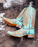 The Honey Dust Trailblazer Corral Boots displayed on cowhide.
