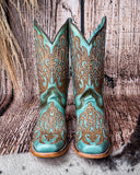 Front view of the Honey Dust Trailblazer Corral Boots with a wood backdrop.