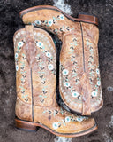 The Luminous Petal Corral Boots displayed on cowhide.