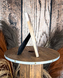 Front view of the Myra Bag - Tumbleweed Trail Photo Frame in Brown and White on a wood background.