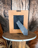 Back view of the Myra Bag - Wyburn Canyon Photo Frame on a wood background.