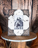 Front view of the Myra Bag - Tumbleweed Trail Photo Frame in Black and White on a wood background.