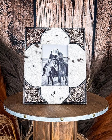 Front view of the Myra Bag - Tumbleweed Trail Photo Frame in Black and White on a wood background.