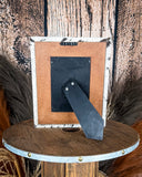 Back view of the Myra Bag - Tumbleweed Trail Photo Frame in Black and White on a wood background.