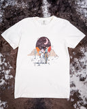 Flat lay of the Vintage Western Boho Graphic Tee on cowhide.