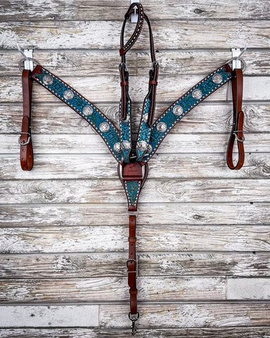 The Turquoise Wash Bull Coin Breast Collar and Headstall displayed on a wood backdrop.