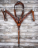 The Turquoise Sunflower Tooled Breast Collar and Browband Headstall displayed on  a wood backdrop.