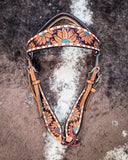 Zoom in of the Turquoise Sunflower Tooled Browband Headstall displayed on cowhide.