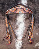 Zoom in of the Turquoise Sunflower Tooled Browband Headstall displayed on cowhide.
