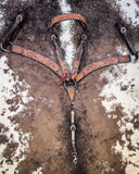 Floral and Sunflower Tooled Breast Collar and Headstall displayed on cowhide.