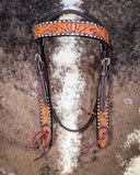 Floral and Sunflower Tooled Headstall displayed on cowhide.