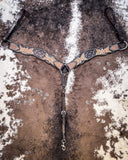 Signature Western Breast Collar displayed on cowhide.