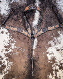 Signature Western Breast Collar and Headstall displayed on cowhide.