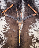 Crystal Collection Breast Collar and Double Ear Headstall displayed on cowhide.