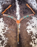 Painted Cactus Breast Collar displayed on cowhide.
