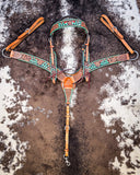 Painted Cactus Breast Collar and Browband Headstall displayed on cowhide.