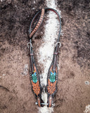 Beaded Cactus One Ear Headstall displayed on cowhide.