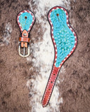 Turquoise Collection Ladies Spur Straps displayed on cowhide.