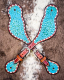 Turquoise Collection Ladies Spur Straps displayed on cowhide.