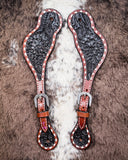 Black Collection Ladies Spur Straps displayed on cowhide.