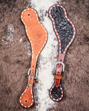 Black Collection Ladies Spur Straps displayed on cowhide.