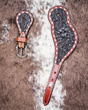 Black Collection Ladies Spur Straps displayed on cowhide.