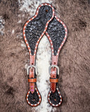 Black Collection Ladies Spur Straps displayed on cowhide.