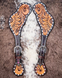 Floral and Sunflower Tooled Ladies Spur Straps displayed on cowhide.