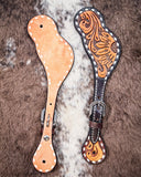Floral and Sunflower Tooled Ladies Spur Straps displayed on cowhide.