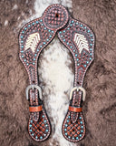 Turquoise Rawhide Ladies Spur Straps displayed on cowhide.