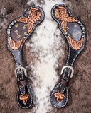 Signature Western Ladies Spur Straps displayed on cowhide.