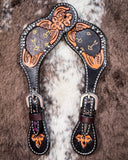 Signature Western Ladies Spur Straps displayed on cowhide.