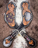 Signature Western Ladies Spur Straps displayed on cowhide.
