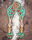 Painted Cactus Ladies Spur Straps displayed on cowhide.