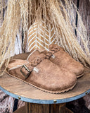 Iris Tooled Slip on Mule in Tan by Very G displayed on a wood backdrop.
