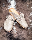 Iris Tooled Slip on Mule in Taupe by Very G displayed on cowhide.