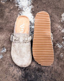 Iris Tooled Slip on Mule in Taupe by Very G displayed on cowhide.