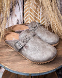 Iris Tooled Slip on Mule in Taupe by Very G displayed on a wood background.