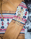 View of the embroidery on the Ladies Legendary Hooey Hoodie in Tan with Thunderbird Accents.