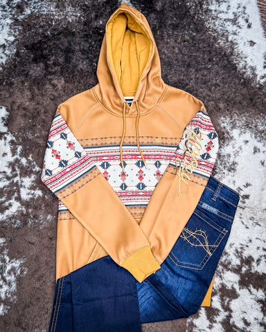 Ladies Legendary Hooey Hoodie in Tan with Thunderbird Accents with Cowgirl Tuff Jeans on cowhide.