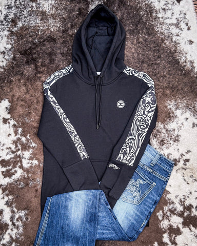 Canyon Ladies Hooey Hoodie being displayed and styles on a cowhide background