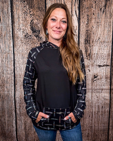 Cinched Up T-Shirt Hoodie on a model in front of a wood backdrop.