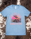 Let it Ride Rodeo Tour Graphic Tee displayed on hide.