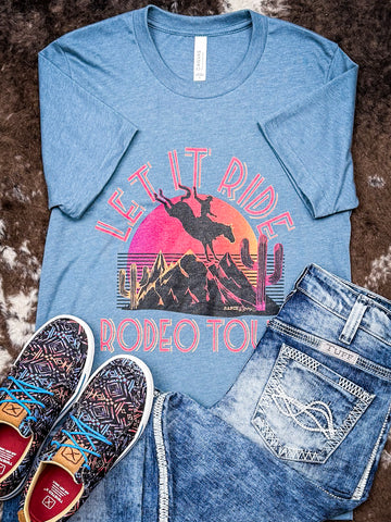 Let it Ride Rodeo Tour Graphic Tee displayed and styled on hide.