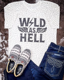 Wild As Hell Graphic Tee displayed and styled on hide background.