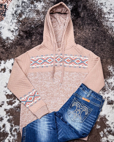 Jimmy Ladies Hooey Hoodie in Portabella with Aztec pattern being styled and displayed on cowhide.