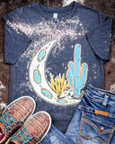 Desert Child Graphic Tee displayed and styled on hide background.