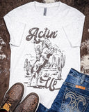 Actin' Up Graphic Tee displayed and styled on hide background.
